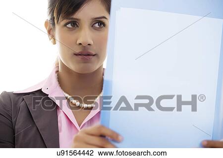 Businesswoman holding a file View Large Photo Image Stock Image - Businesswoman holding a file . Fotosearch