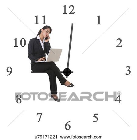 Businesswoman using laptop while sitting on clock hand representing late working against white background View Large Photo Image Stock Image - Businesswoman using laptop while sitting on clock hand representing late working against white background. Fotosearch