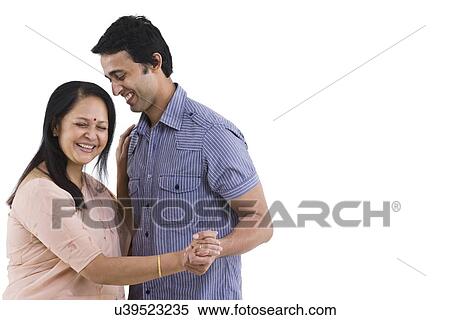 Cheerful mother and son dancing over white background View Large Photo Image Stock Photography - Cheerful mother and son dancing over white background . Fotosearch