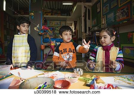 Stock Photo - Children in the art room . Fotosearch