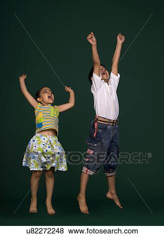 Children jumping View Large Photo Image Stock Photo - Children jumping . Fotosearch