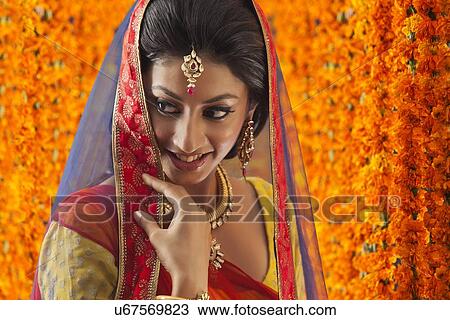 Stock Image - Close-up of a beautiful bride smiling. Fotosearch