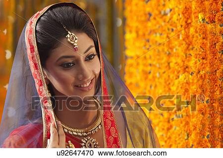 Stock Image - Close-up of a beautiful bride smiling. Fotosearch