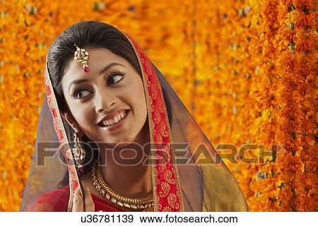 Stock Photo - Close-up of a beautiful bride smiling. Fotosearch
