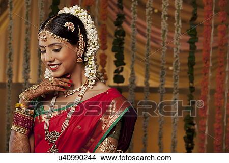 Close-up of a beautiful young woman in bride attire smiling View Large Photo Image Picture - Close-up of a beautiful young woman in bride attire smiling . Fotosearch