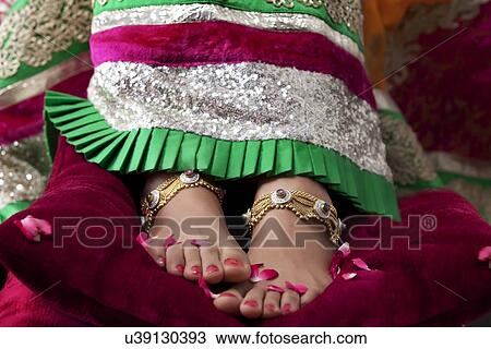 Stock Image - Close-up of a bride's feet. Fotosearch