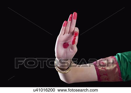 Close-up of a woman's hand making a Bharatanatyam gesture called Arala on black background View Large Photo Image Stock Image - Close-up of a woman's hand making a Bharatanatyam gesture called Arala on black background. Fotosearch