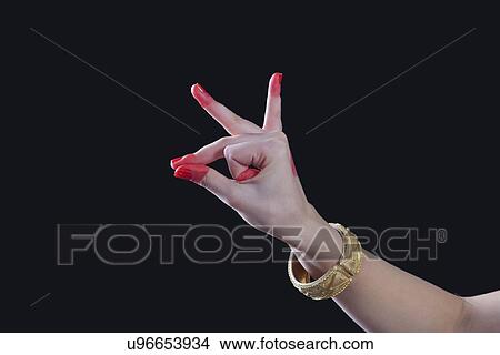 Close-up of a woman's hand making Bharatanatyam gesture called Bhramara on black background View Large Photo Image Picture - Close-up of a woman's hand making Bharatanatyam gesture called Bhramara on black background. Fotosearch