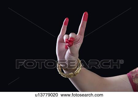 Close-up of a woman's hand making Bharatanatyam gesture called Simhamukha on black background View Large Photo Image Stock Image - Close-up of a woman's hand making Bharatanatyam gesture called Simhamukha on black background. Fotosearch