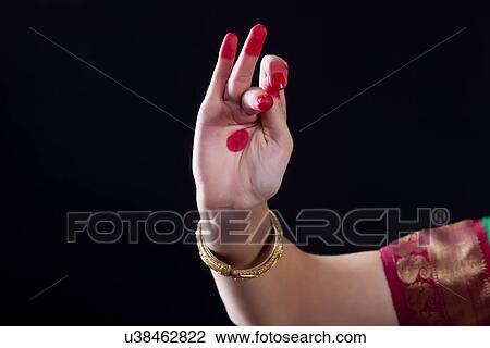 Close-up of a woman's hand making Bharatanatyam gesture on black background View Large Photo Image Stock Image - Close-up of a woman's hand making Bharatanatyam gesture on black background. Fotosearch