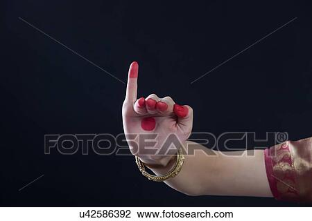 Close-up of a woman's hand making Bharatanatyam gesture called Hamsapaksha on black background View Large Photo Image Stock Image - Close-up of a woman's hand making Bharatanatyam gesture called Hamsapaksha on black background. Fotosearch