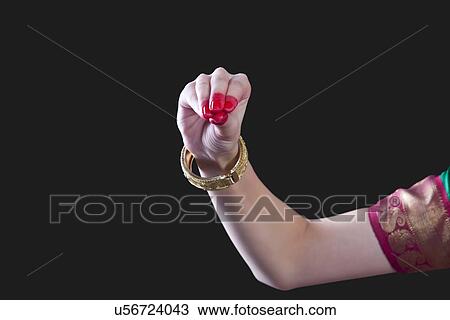 Close-up of a woman's hand making Bharatanatyam gesture called Mukula on black background View Large Photo Image Stock Image - Close-up of a woman's hand making Bharatanatyam gesture called Mukula on black background. Fotosearch