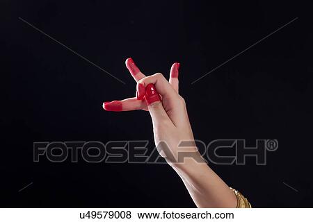 Close-up of a woman's hand making Bharatanatyam gesture on black background View Large Photo Image Stock Photo - Close-up of a woman's hand making Bharatanatyam gesture on black background. Fotosearch