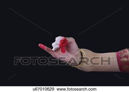 Close-up of a woman's hand making Bharatanatyam gesture called Chatura on black background View Large Photo Image Stock Photo - Close-up of a woman's hand making Bharatanatyam gesture called Chatura on black background. Fotosearch
