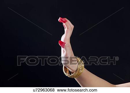 Close-up of a woman's hand making Bharatanatyam gesture called Sarpashirsha on black background View Large Photo Image Stock Photo - Close-up of a woman's hand making Bharatanatyam gesture called Sarpashirsha on black background. Fotosearch