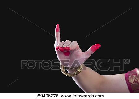 Close-up of a woman's hand making Bharatanatyam gesture called Mrigashirsha on black background View Large Photo Image Stock Photograph - Close-up of a woman's hand making Bharatanatyam gesture called Mrigashirsha on black background. Fotosearch