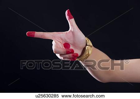 Close-up of a woman's hand making Bharatanatyam gesture called Chandrakala on black background View Large Photo Image Stock Photography - Close-up of a woman's hand making Bharatanatyam gesture called Chandrakala on black background. Fotosearch