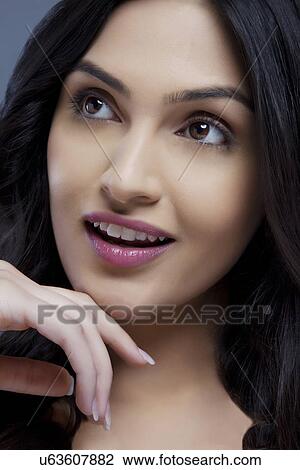 Stock Image - Close-up of a young female looking away . Fotosearch