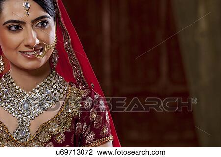 Close-up of an attractive young woman in wedding dress View Large Photo Image Stock Image - Close-up of an attractive young woman in wedding dress . Fotosearch