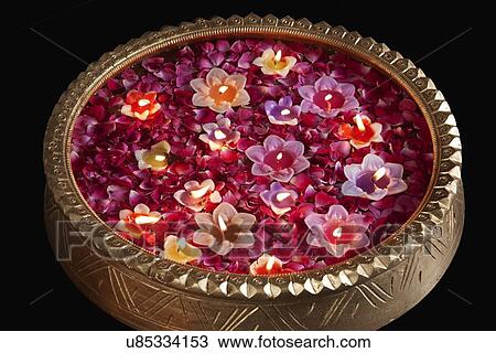 Close-up of an urn with floating diyas View Large Photo Image Stock Image - Close-up of an urn with floating diyas. Fotosearch