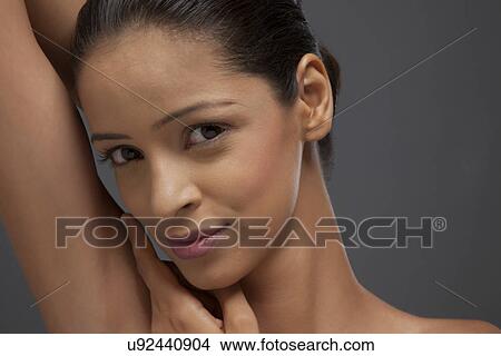 Close-up of beautiful woman over colored background View Large Photo Image Picture - Close-up of beautiful woman over colored background . Fotosearch