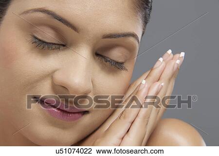 Close-up of beautiful woman with eyes closed View Large Photo Image Stock Image - Close-up of beautiful woman with eyes closed . Fotosearch