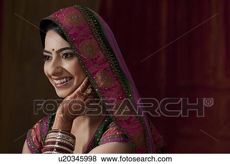 Stock Photo - Close-up of beautiful young Indian bride . Fotosearch