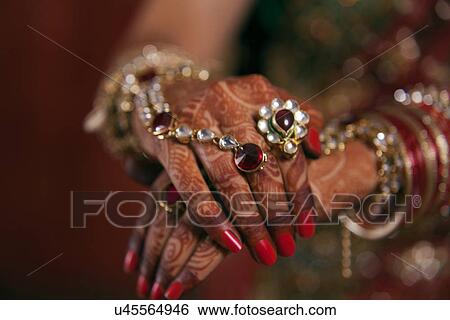 Stock Photograph - Close-up of bridal hands with henna tattoo design . Fotosearch