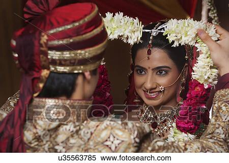 Close-up of bride and groom during wedding ceremony View Large Photo Image Stock Photography - Close-up of bride and groom during wedding ceremony . Fotosearch