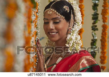 Close-up of bride standing by garlands View Large Photo Image Stock Image - Close-up of bride standing by garlands . Fotosearch