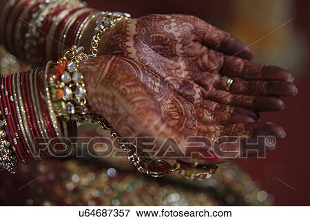 Stock Photo - Close-up of bride's hand on her wedding day . Fotosearch