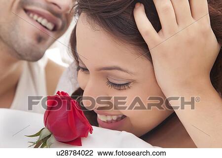 Close-up of couple romancing in bed View Large Photo Image Stock Image - Close-up of couple romancing in bed. Fotosearch