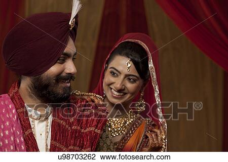 Close-up of couple smiling View Large Photo Image Stock Image - Close-up of couple smiling . Fotosearch
