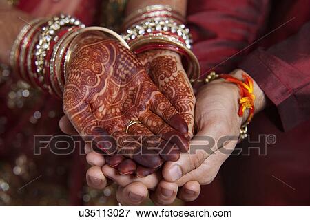 Stock Photo - Close-up of couple's hand . Fotosearch