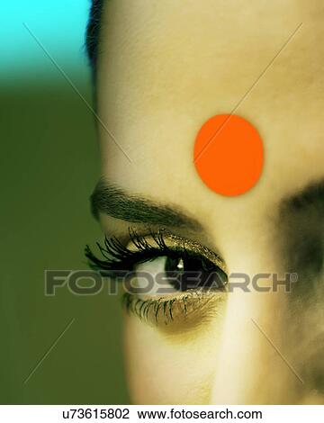 Stock Image - Close-up of eye and bindi of a woman . Fotosearch
