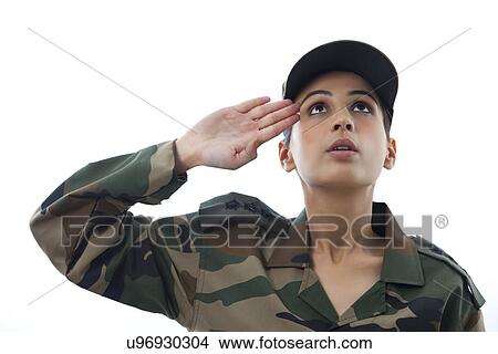 Picture - Close-up of female soldier saluting looking up . Fotosearch