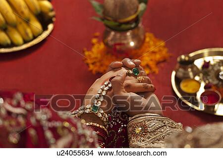 Close-up of groom holding brides hand View Large Photo Image Picture - Close-up of groom holding brides hand . Fotosearch