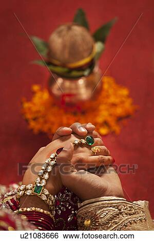 Close-up of groom holding brides hand View Large Photo Image Stock Photograph - Close-up of groom holding brides hand . Fotosearch