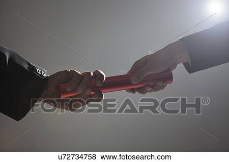 Close-up of hands holding a baton View Large Photo Image Stock Photo - Close-up of hands holding a baton . Fotosearch