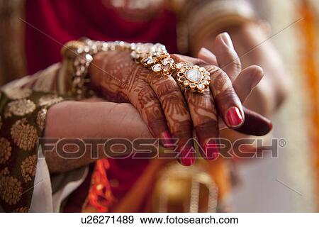 Close-up of hands of groom and bride View Large Photo Image Stock Photo - Close-up of hands of groom and bride . Fotosearch