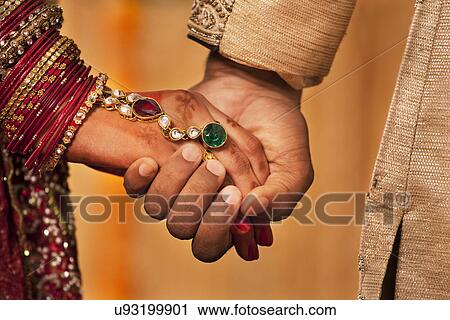 Close-up of hands of newly married Indian couple View Large Photo Image Stock Image - Close-up of hands of newly married Indian couple . Fotosearch