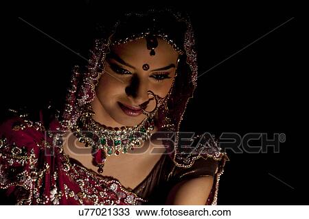 Close-up of Indian bride in wedding attire and jewelery View Large Photo Image Stock Image - Close-up of Indian bride in wedding attire and jewelery . Fotosearch