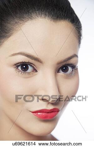 Picture - Close-up of lovely young woman over white background . Fotosearch