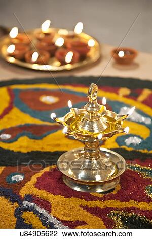 Close-up of rangoli with diyas View Large Photo Image Stock Image - Close-up of rangoli with diyas. Fotosearch