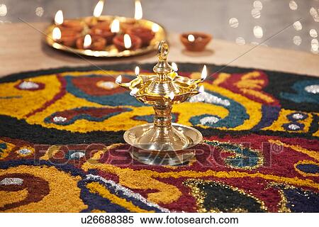 Close-up of rangoli with diyas View Large Photo Image Stock Photography - Close-up of rangoli with diyas. Fotosearch