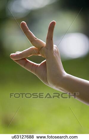 Stock Photo - Close-up of woman's hand in yoga gesture . Fotosearch