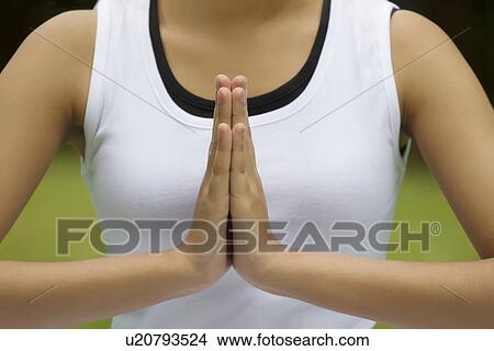 Close-up of woman's hands in prayer position View Large Photo Image Picture - Close-up of woman's hands in prayer position . Fotosearch