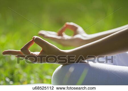 Stock Image - Close-up of woman's hands in yoga gesture . Fotosearch