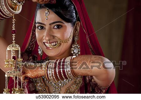 Close-up portrait of a beautiful woman in traditional jewelry View Large Photo Image Stock Photography - Close-up portrait of a beautiful woman in traditional jewelry . Fotosearch