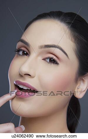 Stock Image - Close-up portrait of a young female . Fotosearch